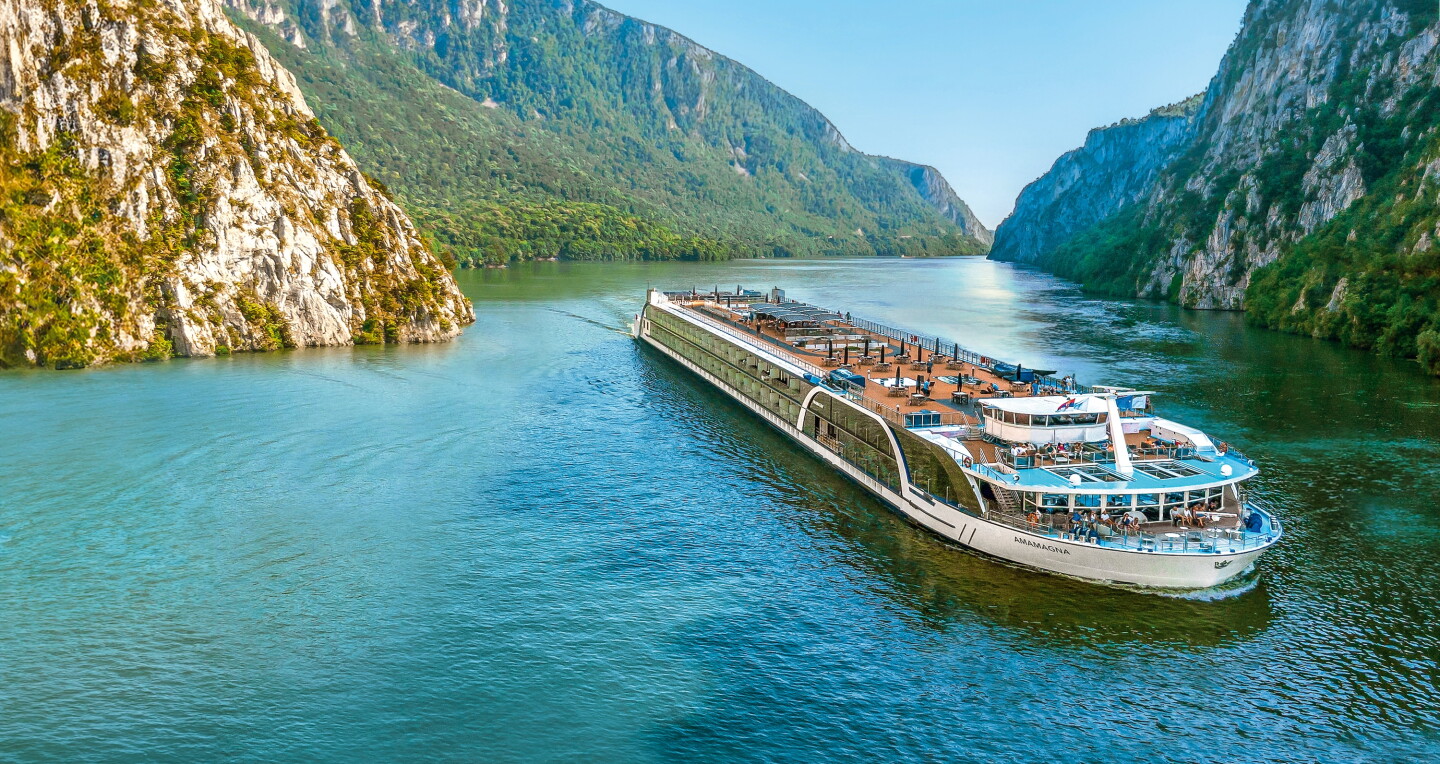 A river cruise ship in a Danube gorge, seen from above